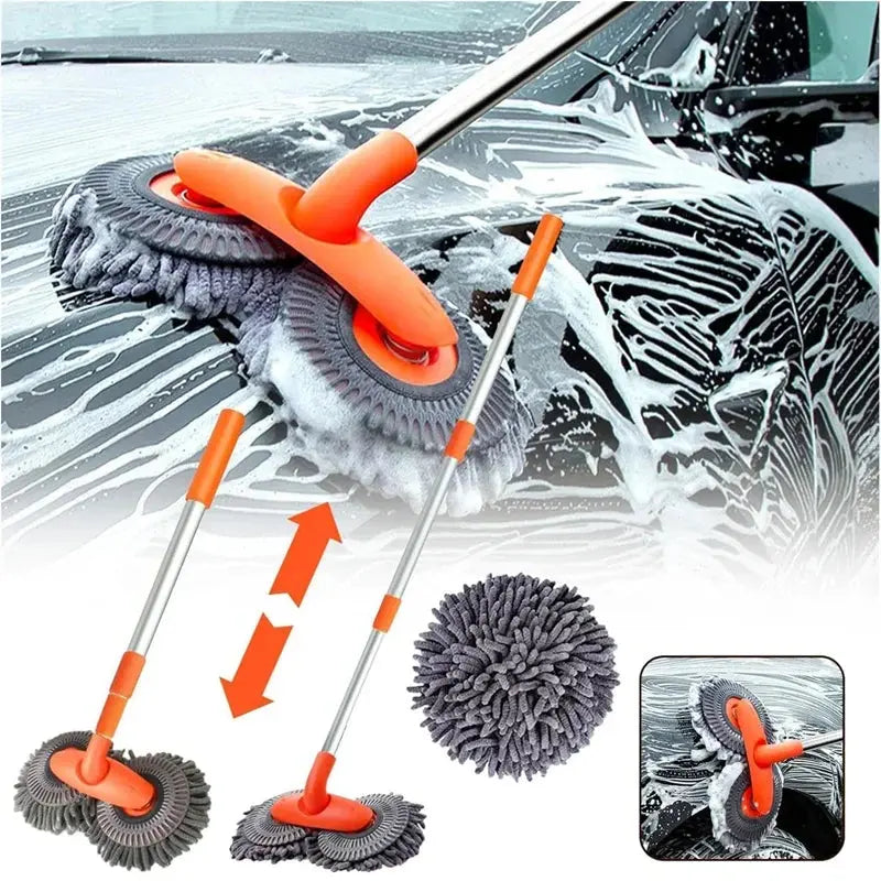 Car cleaning brush with extendable handle and wash mitt on a car window with soap suds.