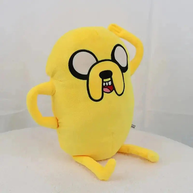 Yellow plush toy with a cartoon face on a white background