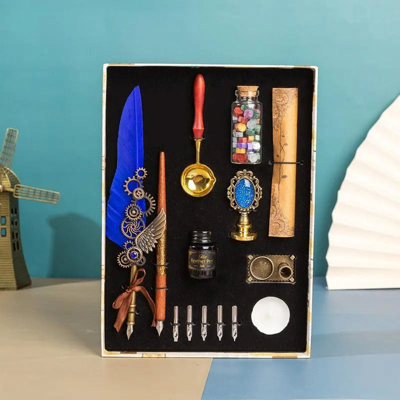 Retro feather pen gift box with brass pen, wax seal accessories, calligraphy tools, and multi-color wax beads in luxury packaging