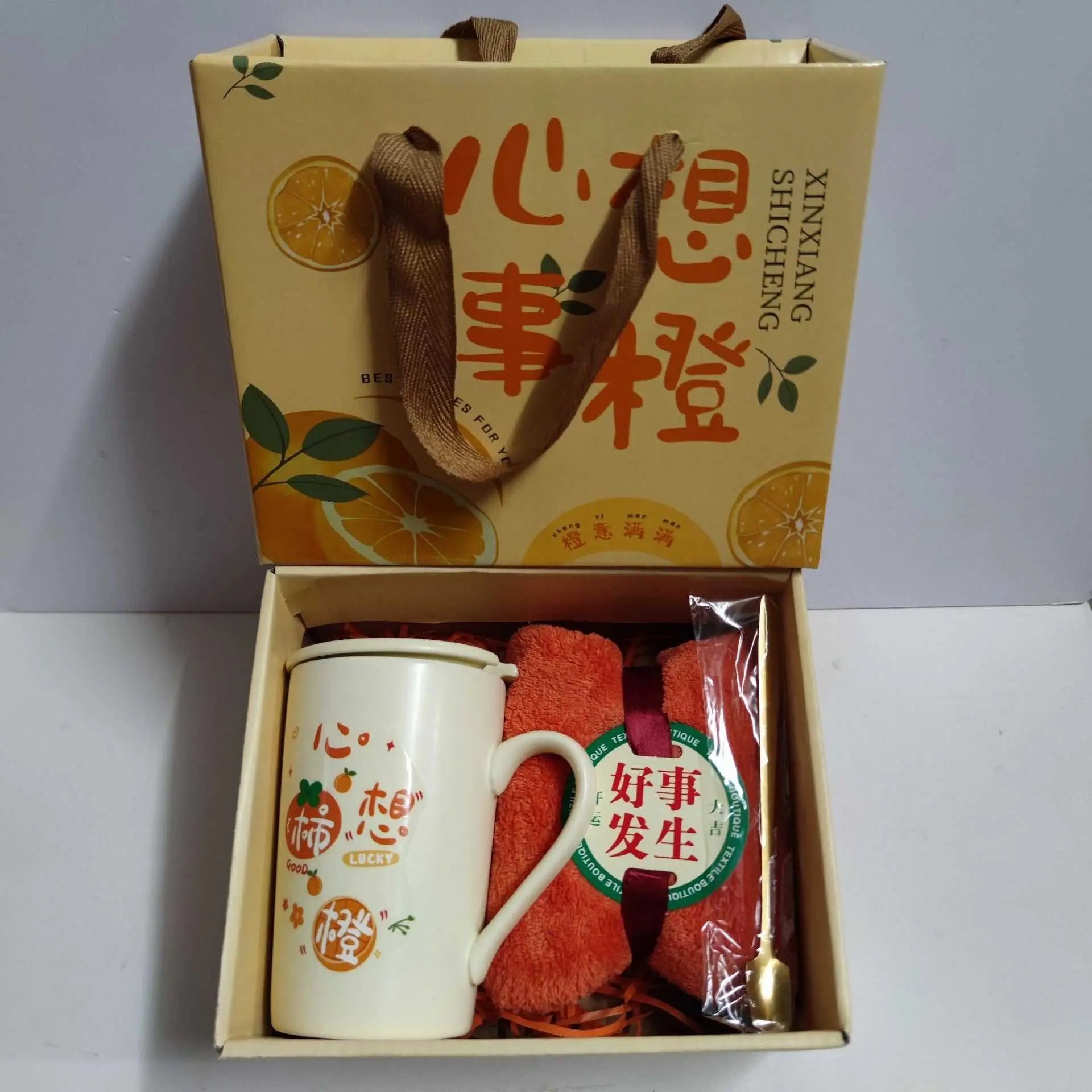 Ceramic cup gift box set with letter print mug, spoon, towel, and eco-friendly packaging.