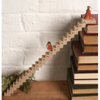 Wooden Santa Claus ladder countdown calendar with numbered steps from 1 to 24, festive Christmas decoration for holiday countdown.