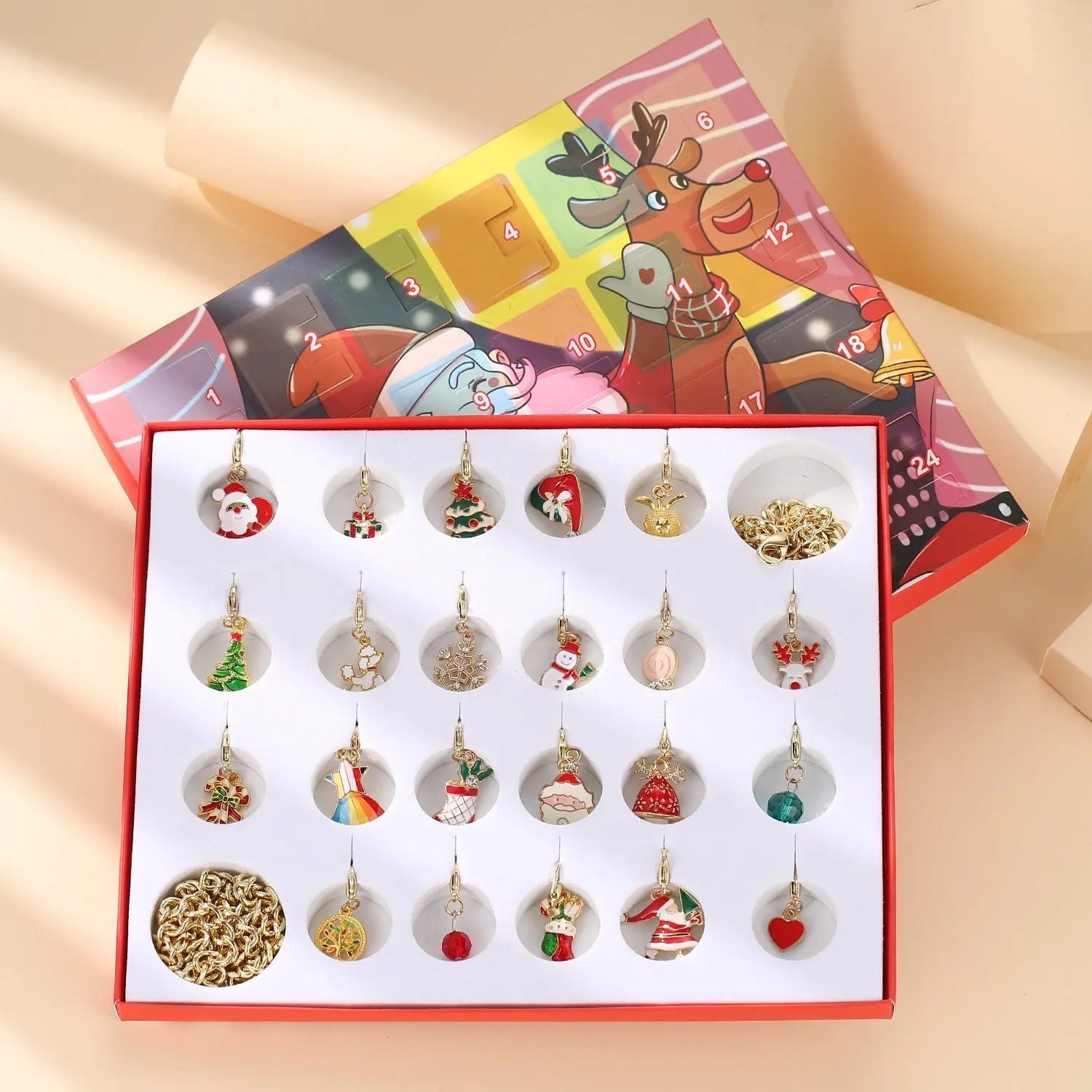Children’s Charm Bracelet & Necklace Advent Calendar with 22 Christmas-themed charms in a festive gift box