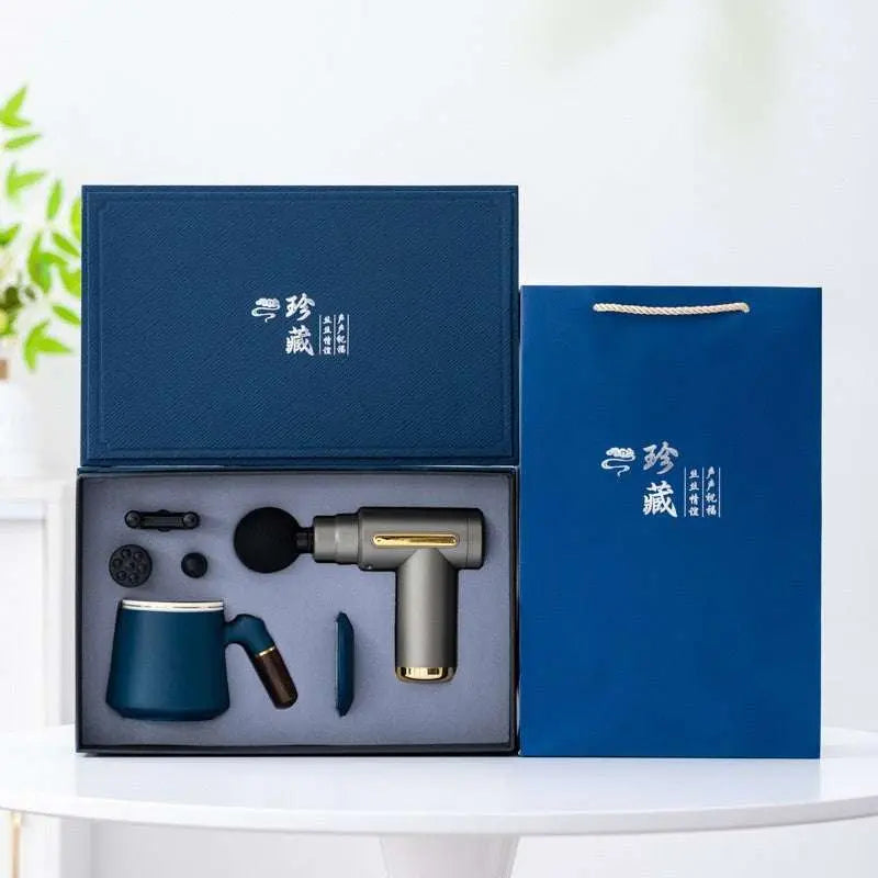 Massage gun gift box with ceramic mug and multiple massage heads in luxury blue packaging