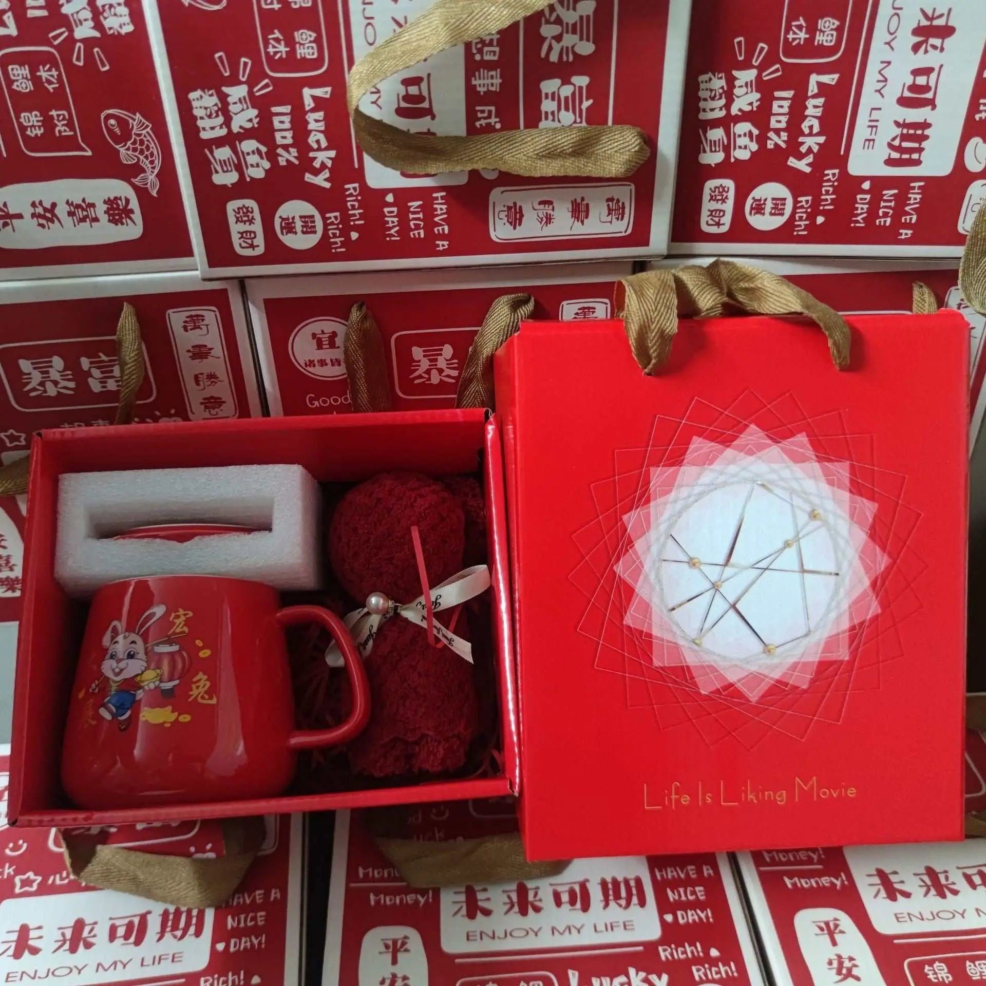 Red ceramic cup gift box with rabbit print mug, towel, and packaging