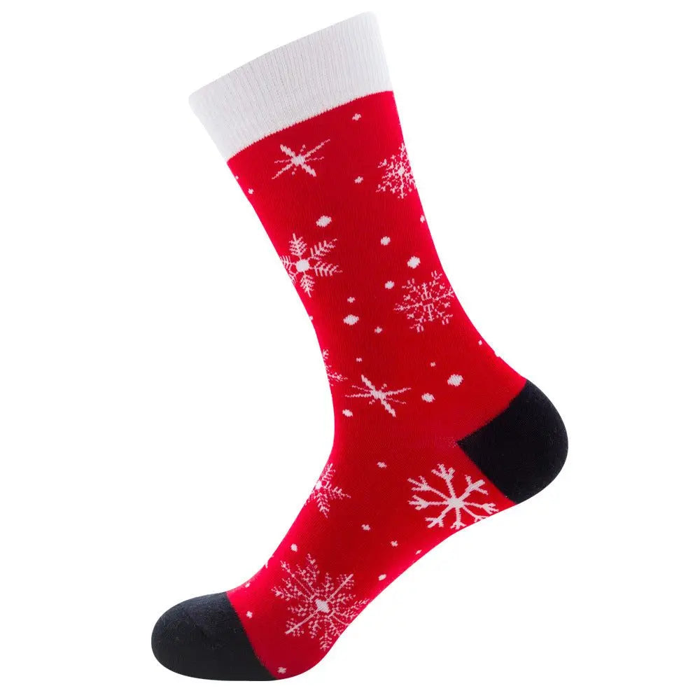 Festive men's cotton sock in red with white snowflakes and black heel and toe, mid-tube jacquard design