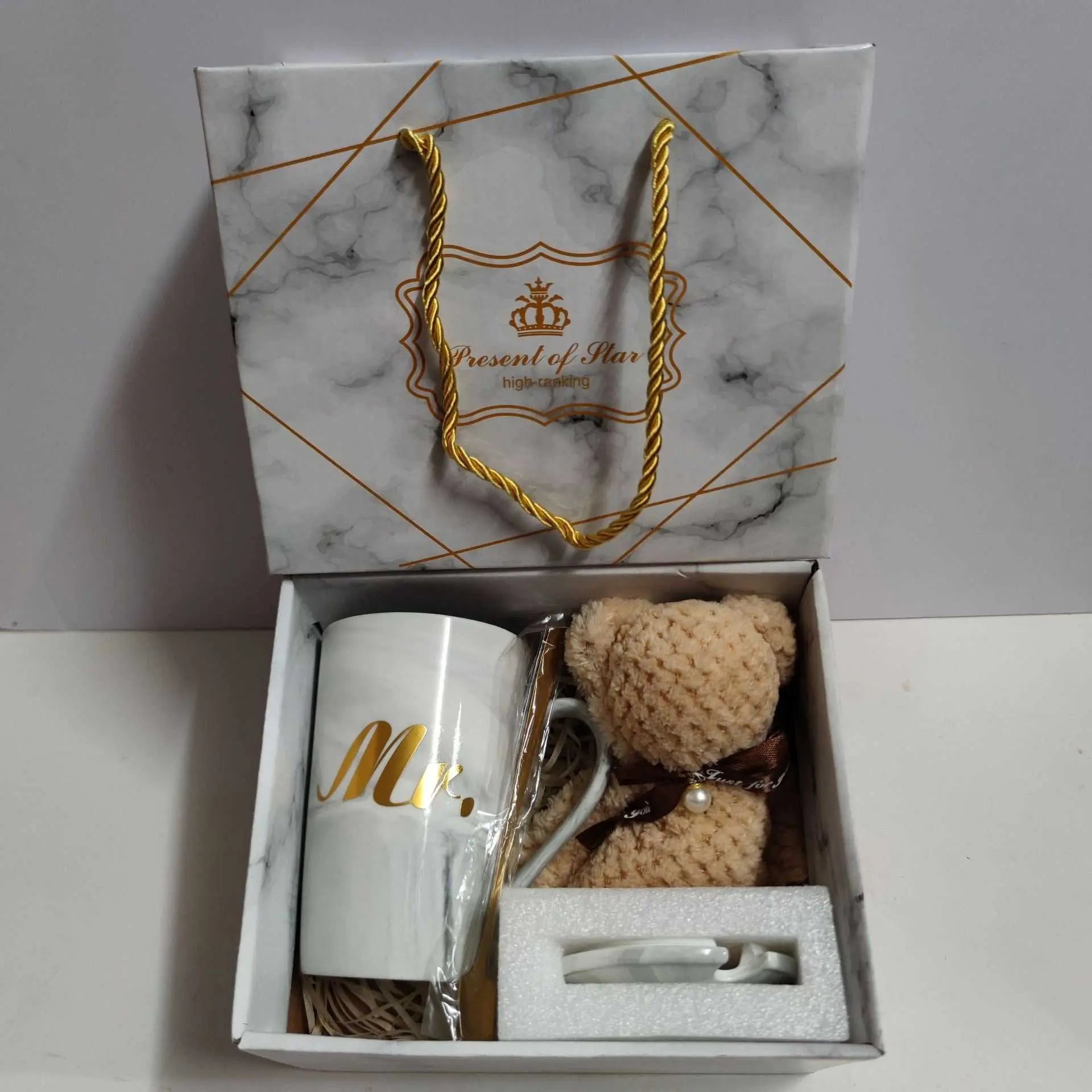 Ceramic cup gift box set with letter print mug, spoon, towel, and elegant packaging.